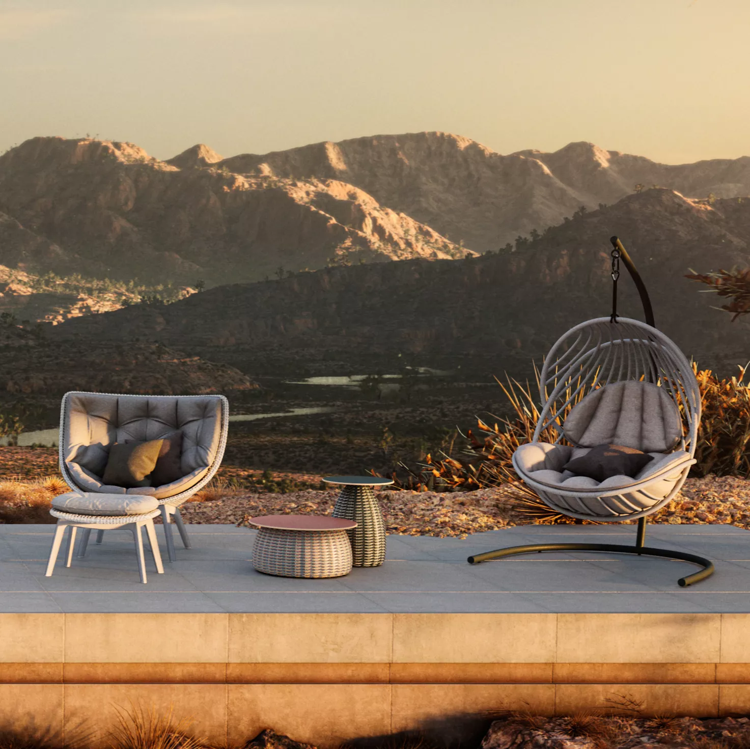 Dedon Porcini Beistelltisch 51 cm in einer Outdoor-Szene mit einem Hängesessel und einem Sessel vor einer Berglandschaft bei Sonnenuntergang.