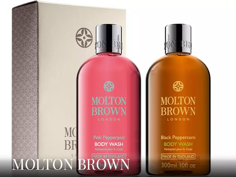 Molton Brown Pink Pepperpod und Black Peppercorn Body Wash, 300ml, vor beigem Hintergrund mit Verpackung, Produktfoto.