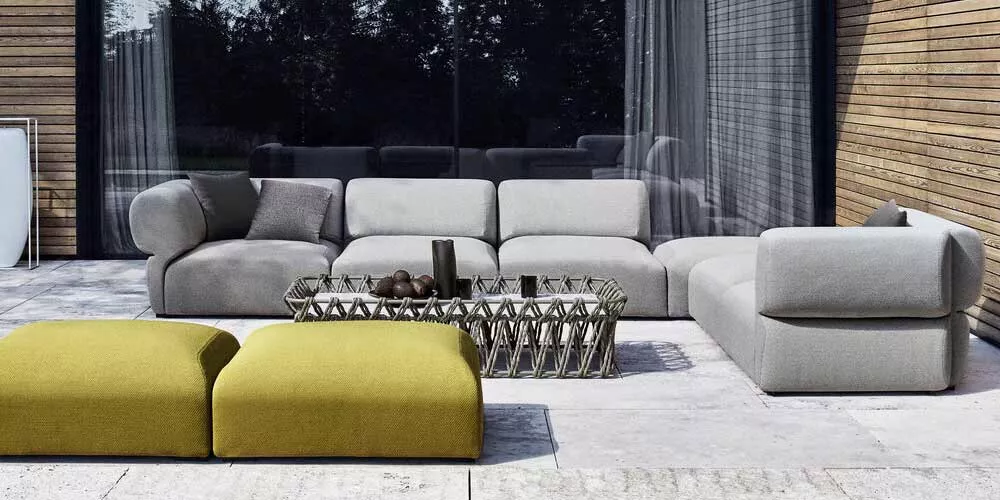 B&B Italia Butterfly Loungegruppe Loungesofa auf einer Terrasse mit modernem Design und grünen Hockern im Vordergrund