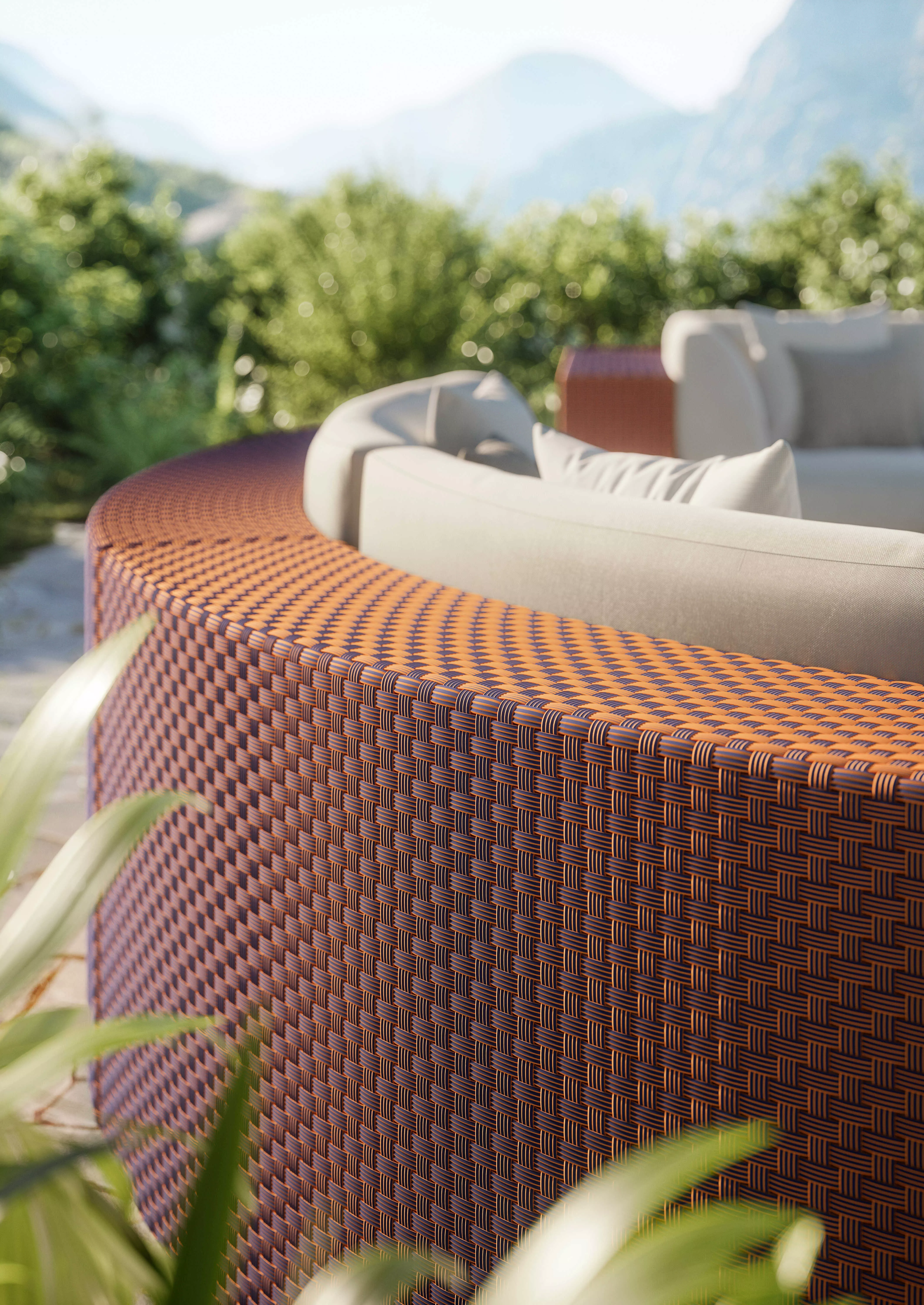 DEDON Mystique Bluo Lounge in einer Berglandschaft mit grünen Pflanzen im Hintergrund