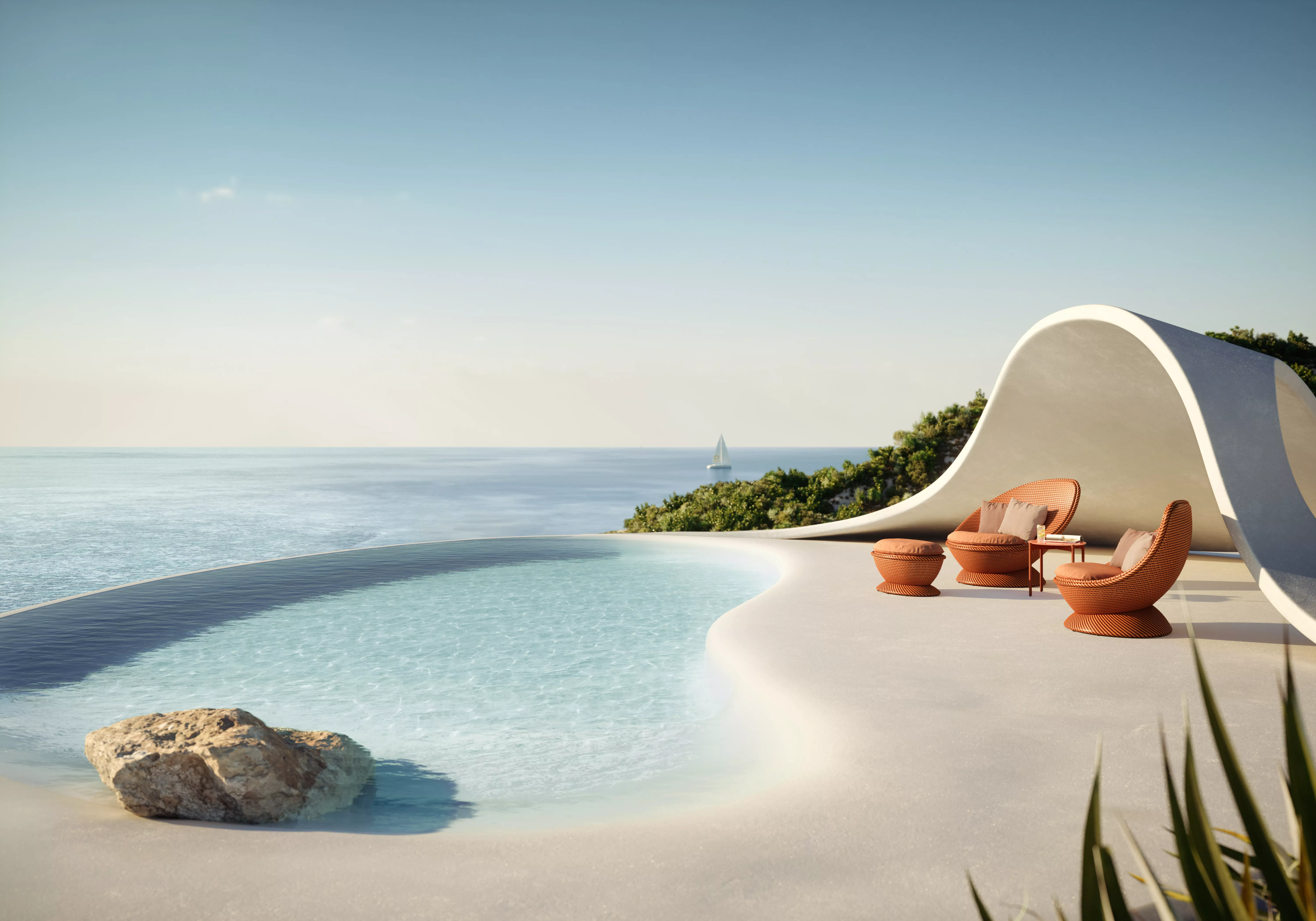 Dedon Endless Ocean Papyon Möbel auf einer Terrasse mit Blick auf das Meer und einem Segelboot im Hintergrund