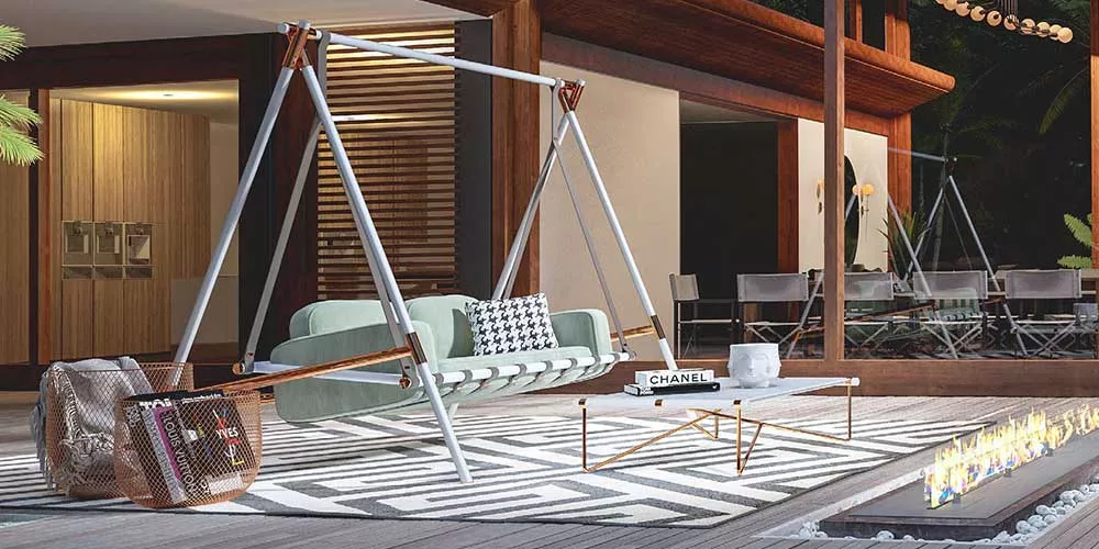 Mayface Fable Loungegruppe in Mintgrün auf moderner Terrasse mit Holzboden und Feuerstelle, umgeben von stilvollen Accessoires.