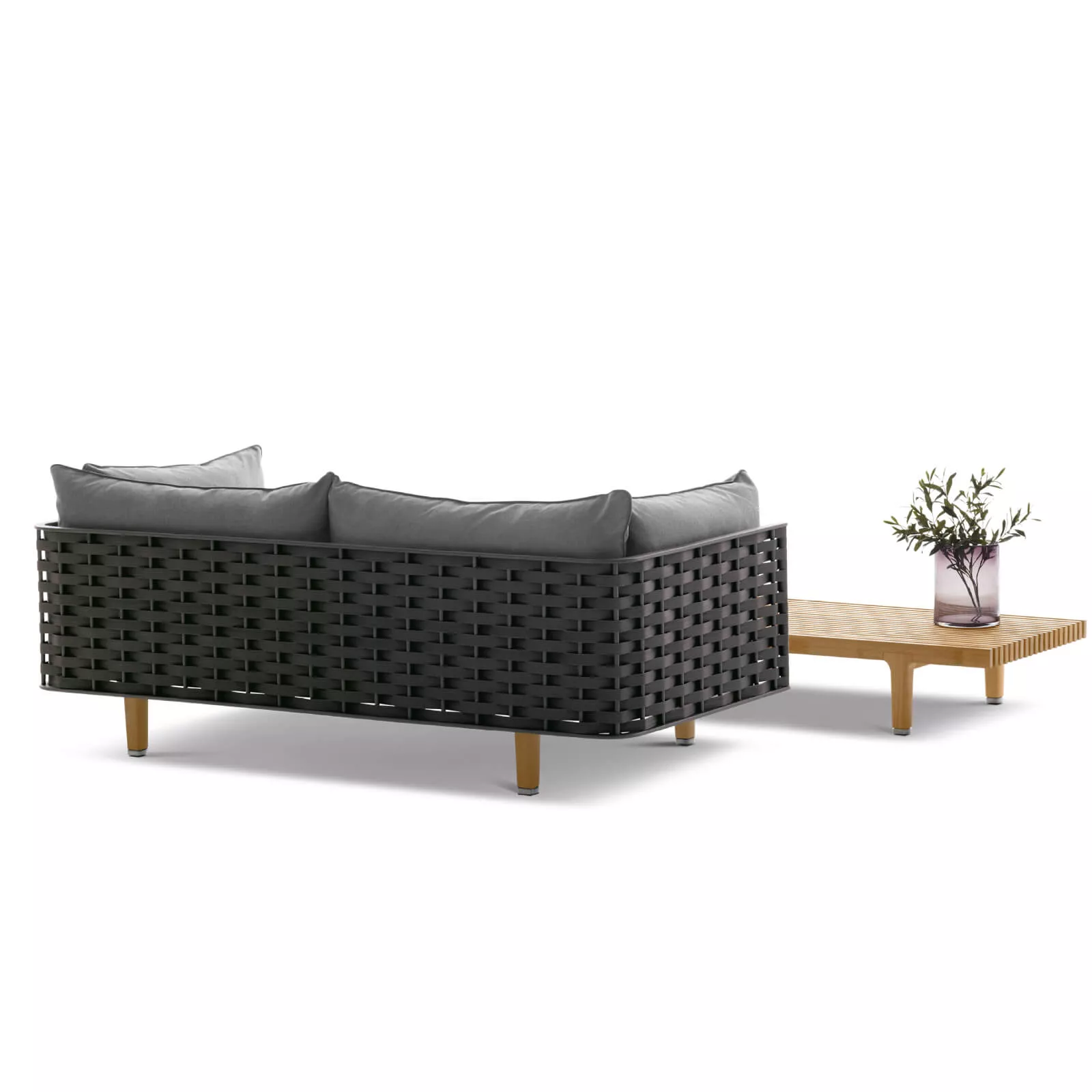 Dedon Sealine 2er Sofa in Schwarz mit grauen Kissen und einem Holztisch mit einer Vase und Pflanzen darauf ohne Hintergrund