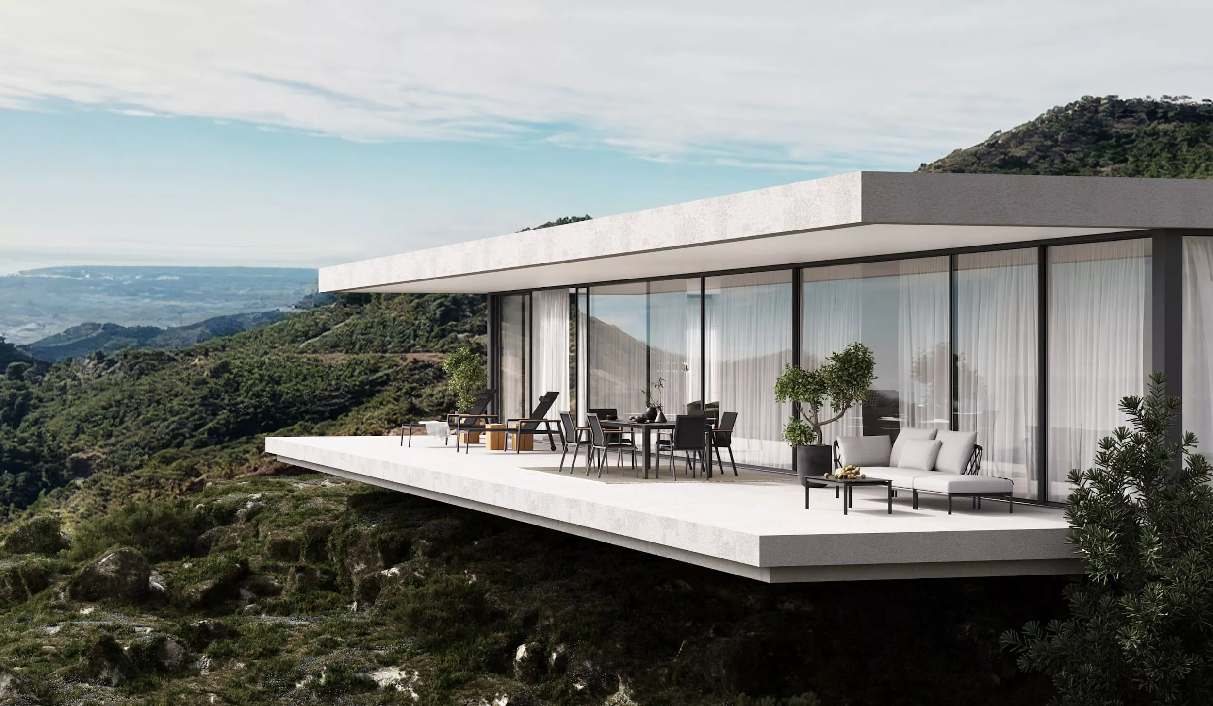Ein modernes Haus mit großer Terrasse und Solpuri Soul Möbeln in den Bergen mit Blick auf die Landschaft und den Himmel mood picture.