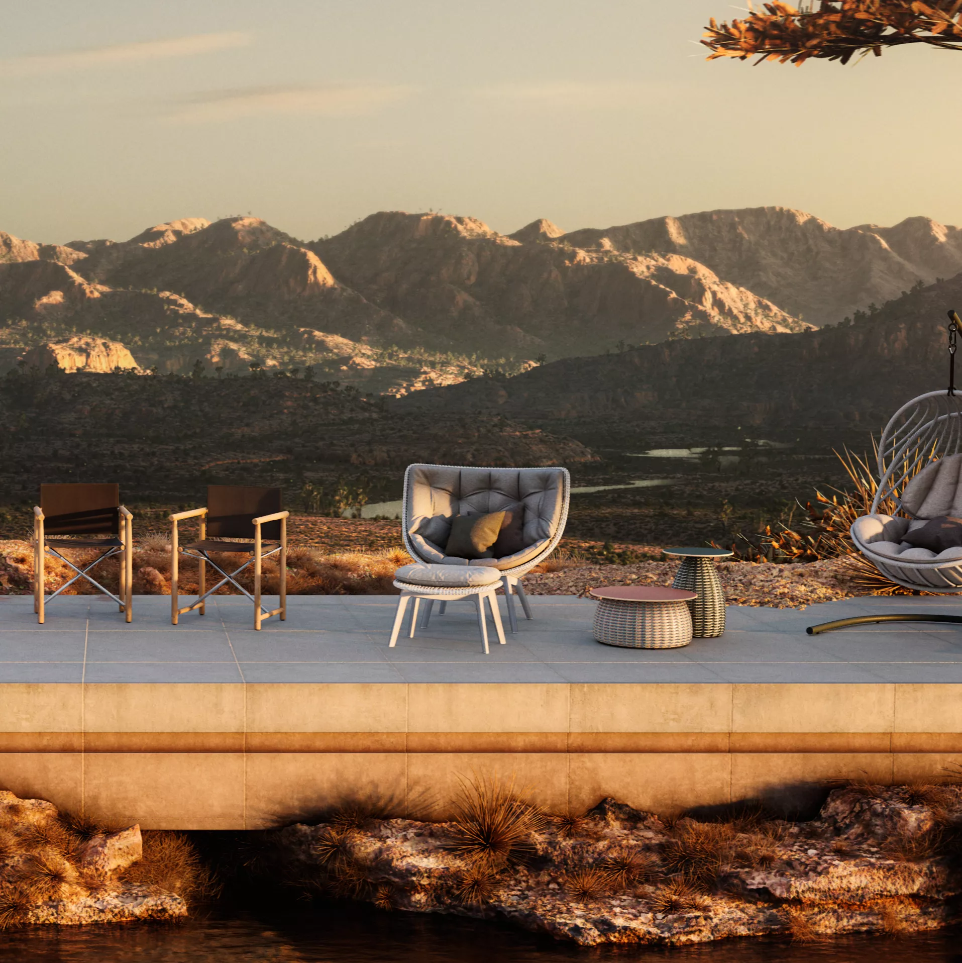 Dedon Mbrace Sessel und Beistelltische auf einer Terrasse mit Bergblick im Hintergrund