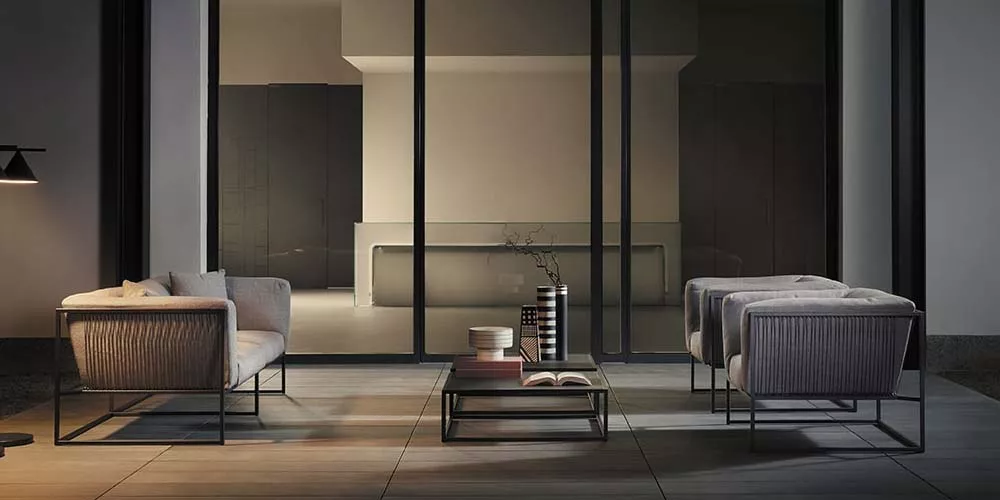 MDF Italia Arpa Sofa in Grau, modernes Wohnzimmer-Setting mit minimalistischem Design und eleganter Beleuchtung.